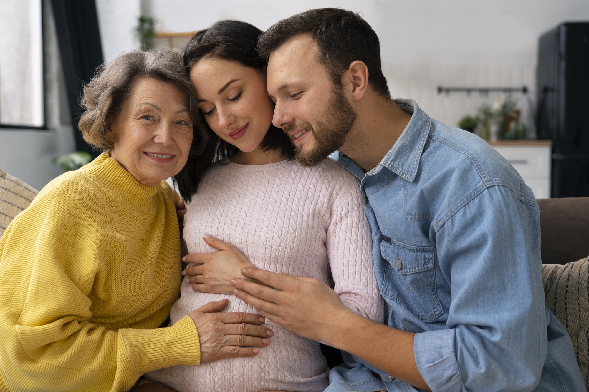 medium shot happy family expecting baby